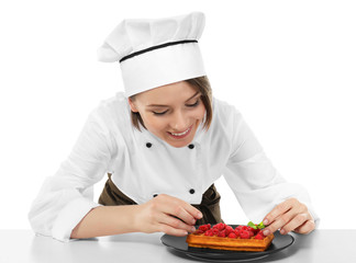 Sticker - Female chef with tasty dessert on white background