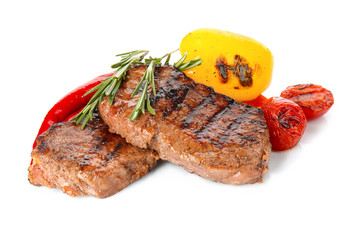 Wall Mural - Tasty steaks with vegetables on white background