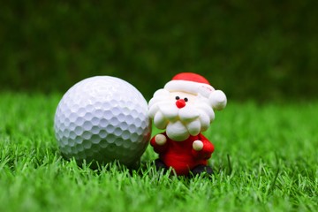 Wall Mural - Santa with golf ball for golfer's Christmas holiday concept