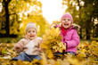 © Martinan - Siblings having fun outdoors, looking at camera.