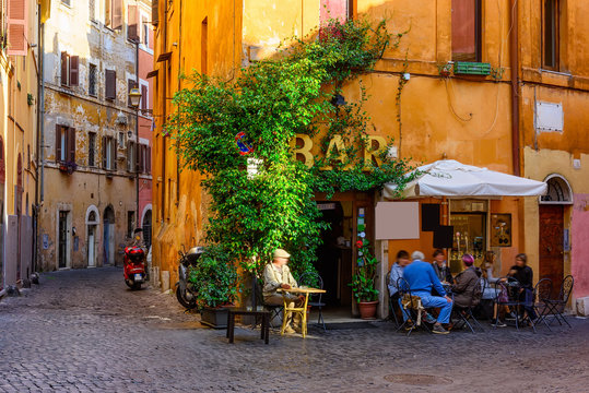 cozy old street in trastevere in rome, italy