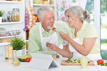 senior couple preparing dinner