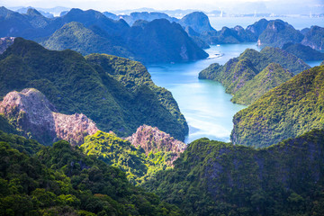 scenic view over Ha Long bay from Cat Ba island, Ha Long city in the background, UNESCO world heritage site, Vietnam