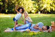 © NDABCREATIVITY - Picture of lovely couple with their daughter having picnic