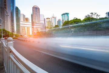 Wall Mural - The light trails on the modern building background in shanghai china.