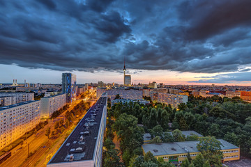 Wall Mural - Dark clouds over downtown Berlin at sunset with the Television Tower in the back