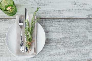 Rustic table setting with rosemary