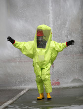 Yellow Protective Suit With Air Filtering System To Breathe Duri