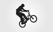 Cyclist rider bmx performs trick jump logo silhouette vector