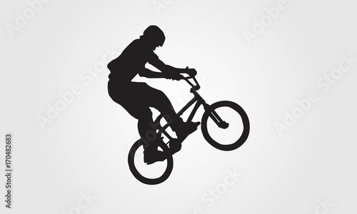 Cuadros en Lienzo Cyclist rider bmx performs trick jump logo silhouette vector