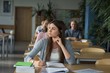 © Wavebreak Media - Thoughtful female college student at desk during exam