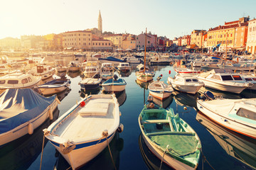 Wall Mural - Sunset at medieval town of Rovinj, colorful with houses and church,harbor