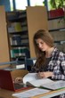 © Wavebreak Media - Young female student using laptop while studying