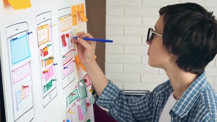 Creative UX designer doing usability research for mobile application