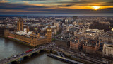 Fototapeta Big Ben - London, England - Aerial skyline view of the Big Ben and Houses of Parliament, Westminster Bridge with red double decker buses, St Margaret's Church, St James's Park and Buckingham Palace at sunset