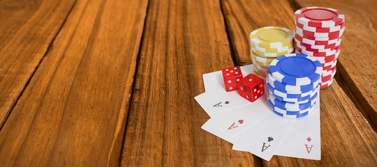 Wall Mural - Composite image of high angle view of casino tokens with playing