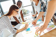 © zinkevych - Cheerful young colleagues planning their future work