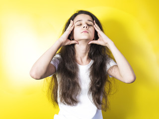 Wall Mural - Close up portrait of brunette pretty woman with headache touching her face, look up. Health care and medicine.