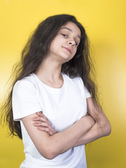 Wall Mural - Isolated shot of angry girl holding arms crossed