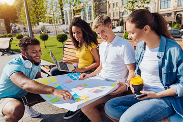 Wall Mural - Attentive students listening their group mate