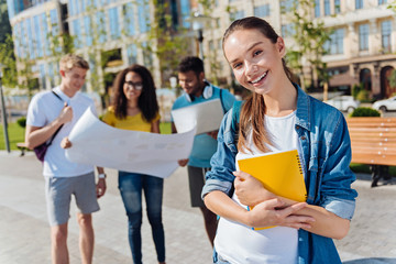 Wall Mural - Delighted young female person being ready for lessons