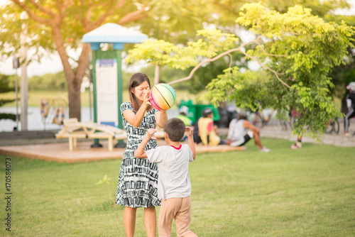 Single Mom Mother And Son Play Football Together In The Park Buy