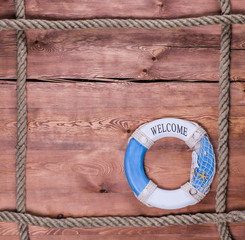 Poster - Rope frame on a wooden background