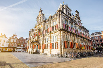 Wall Mural - View on the Town hall and beautiful buildings on the central square during the sunny morning in Delft city, Netherland