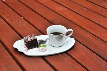 Wall Mural - white cup of hot coffee on wooden,white cup of hot coffee on wooden  on green natural background