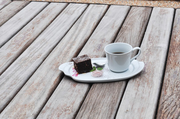 Wall Mural - white cup of hot coffee on wooden,white cup of hot coffee on wooden  on green natural background