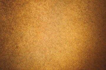 old aged suede leather background. coarse texture, gradient yellow brown beige, vivid colors. vignet