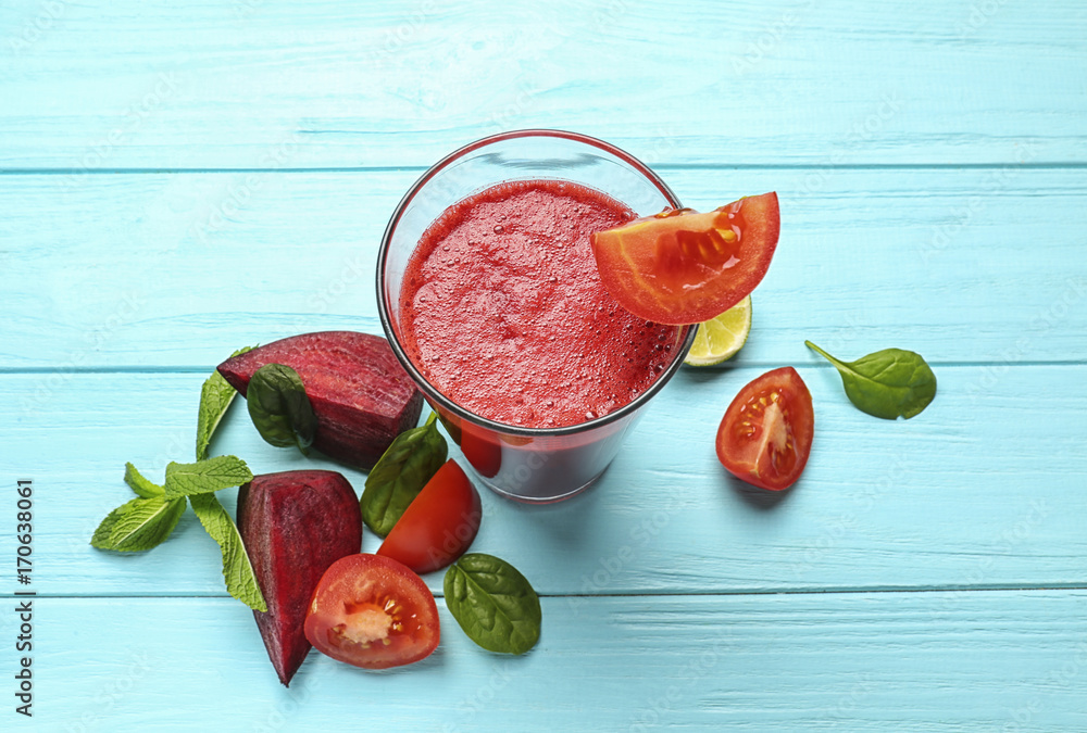 Glass of fresh vegetable smoothie on wooden table