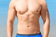 © Africa Studio - Handsome young man on sea beach