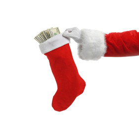 Santa Claus holding stocking with money on white background