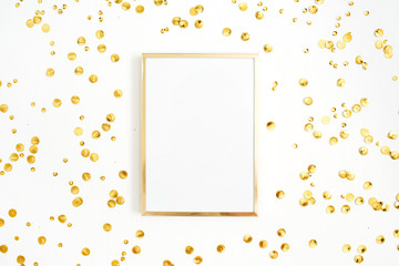 Photo frame mock up with space for text and golden confetti on white background. Flat lay, top view. Minimal background.