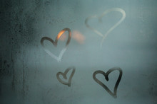 Hearts Drawn By Hand On A Glass Window