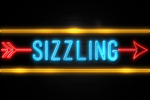 Sizzling  - Fluorescent Neon Sign On Brickwall Front View