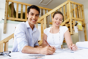 Two young architects in office