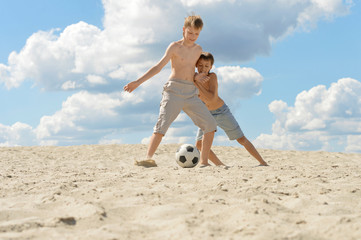 Poster - brothers playing  football