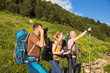 © lkoimages - Hiking in beautiful mountains. Group of hikers enjoy the weather