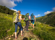 © lkoimages - Hiking in beautiful mountains. Group of hikers enjoy the weather