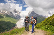 © lkoimages - Hiking in beautiful mountains. Group of hikers enjoy the weather