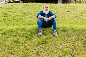 senior man resting on ground