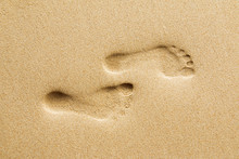 Footprints On Beach.