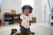 © Monkey Business - Portrait Of Happy Baby Girl Playing With Toys In Playroom