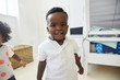 © Monkey Business - Portrait Of Smiling Young Boy Standing In Playroom