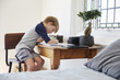 © Monkey Business - Boy Sits At Desk In Bedroom With Digital Tablet Doing Homework
