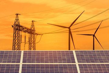 Wall Mural - solar cells and wind turbines generating electricity with high voltage electrical power pylon in pow