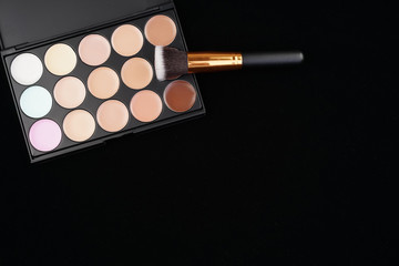 Beauty concept. Cosmetic accessories on black background from top view or flat lay.