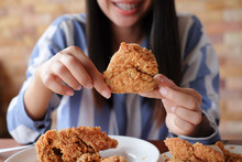 Close Up Focus Woman Hand Hold And Showing Fried Chicken Meal For Eat At Restaurant Bar,fast Food Concept,healthcare Living 